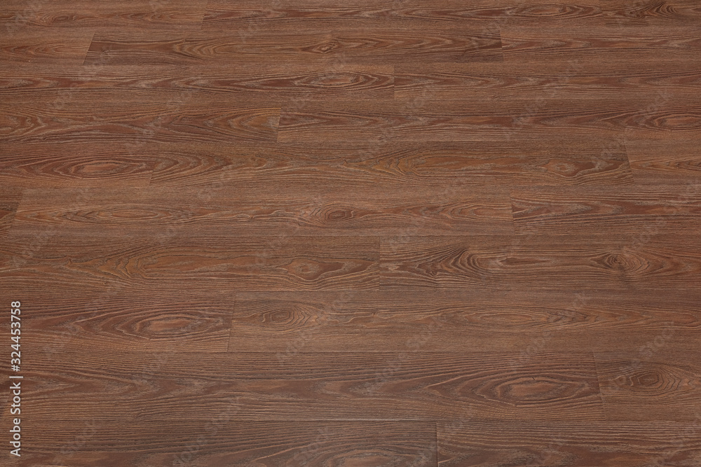 Fototapeta premium Natural dark brown wooden surface floor texture background. polished laminate parquet