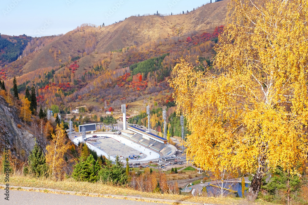Medeu valley in autumn season; Medeo outdoor speed skating rink in the outskirts of Almaty city, Kazakhstan