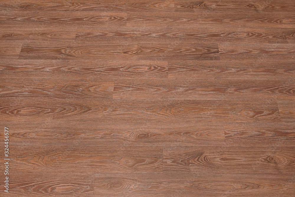 Fototapeta premium Natural dark brown wooden surface floor texture background. polished laminate parquet