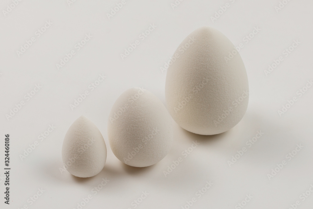 Small, medium and large white beauty blender isolated. Small, medium and large white beauty blender isolated.