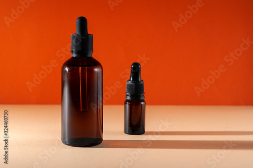 Cosmetic aromatic spa oil in brown glass bottle