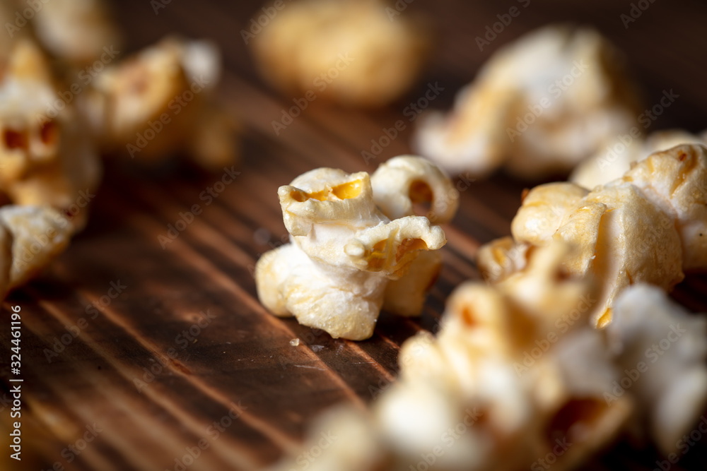 Popcorn flakes on a wooden background Popcorn flakes on a wooden background