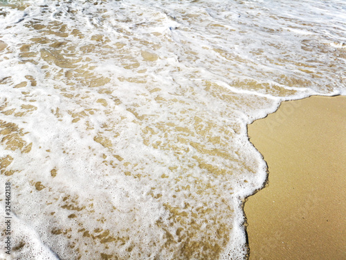 sand and water on the seashore as a background