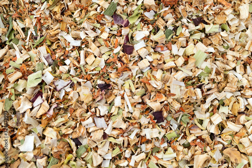 Texture background. Green spice mix dried vegetables and herbs.