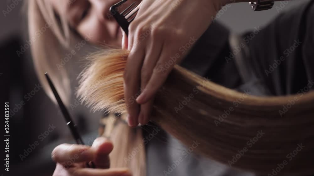 Hair salon girl haircuts. Close up 4K slow motion
