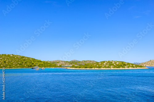 Croatian islands on Adriatic Sea. Croatia with rocky coastline, sailing boats and yachts.