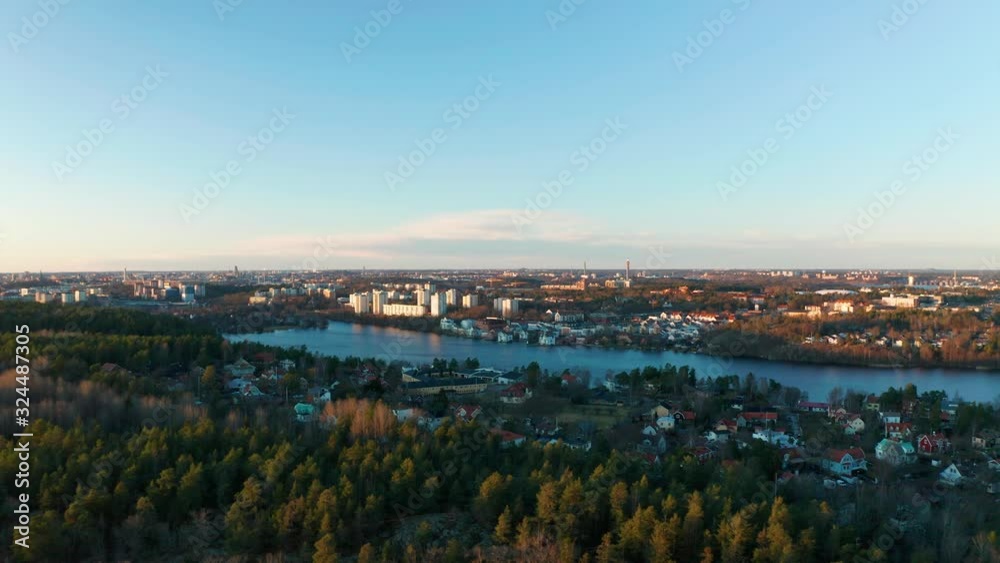 Drone flies forwards over calming pine forest, Sweden. Aerial view of beautiful lake, Scandinavia. Drone flies forwards over calming pine forest, Sweden. Aerial view of beautiful lake, Scandinavia.