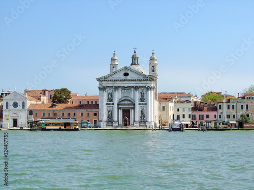 View of a traveler from the deck of a ship on the beauty of medieval architecture of the cathedrals and temples of Venice. © Hennadii