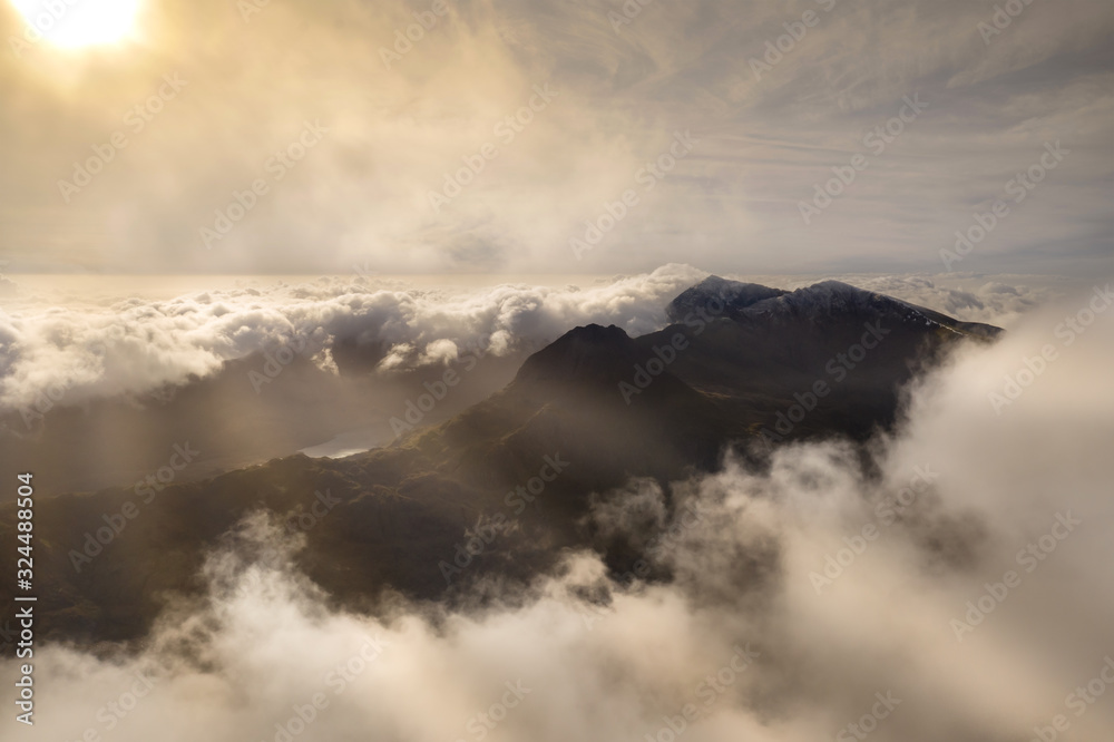 Snowdonia aerial view with low clouds and sunrise, Wales UK