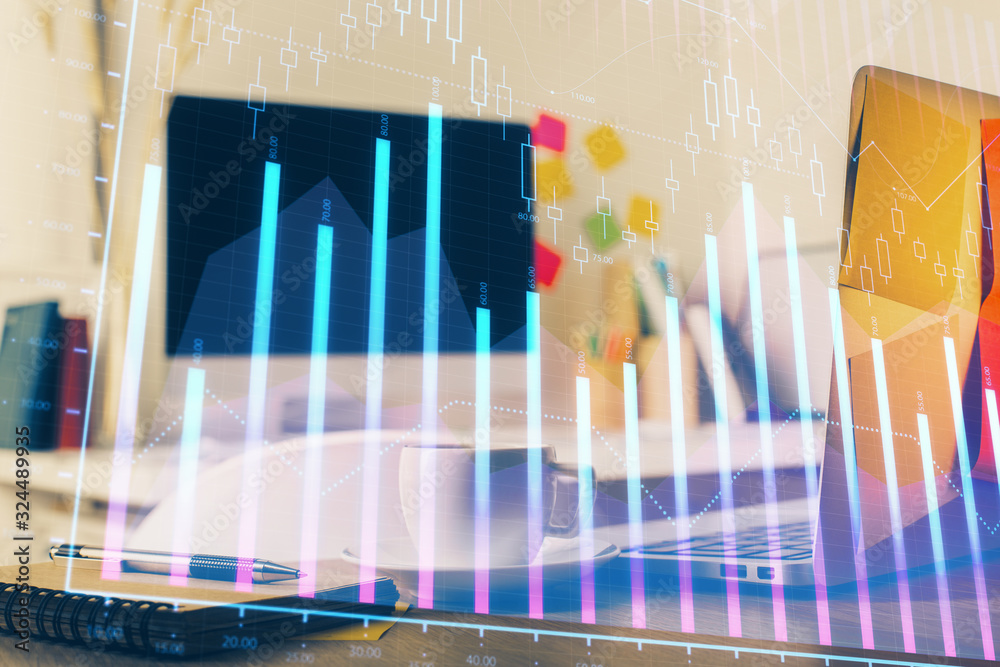 Forex market graph hologram and personal computer on background. Multi exposure. Concept of investment. Forex market graph hologram and personal computer on background. Multi exposure. Concept of investment.