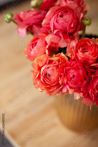 Elegance ranunculus bouquet on a wooden table. Beautiful flowers composition in bright rosy colors. Perfectly for Birthday Celebration  Women s and Valentine s Day  Anniversary. Copy space. Top view.