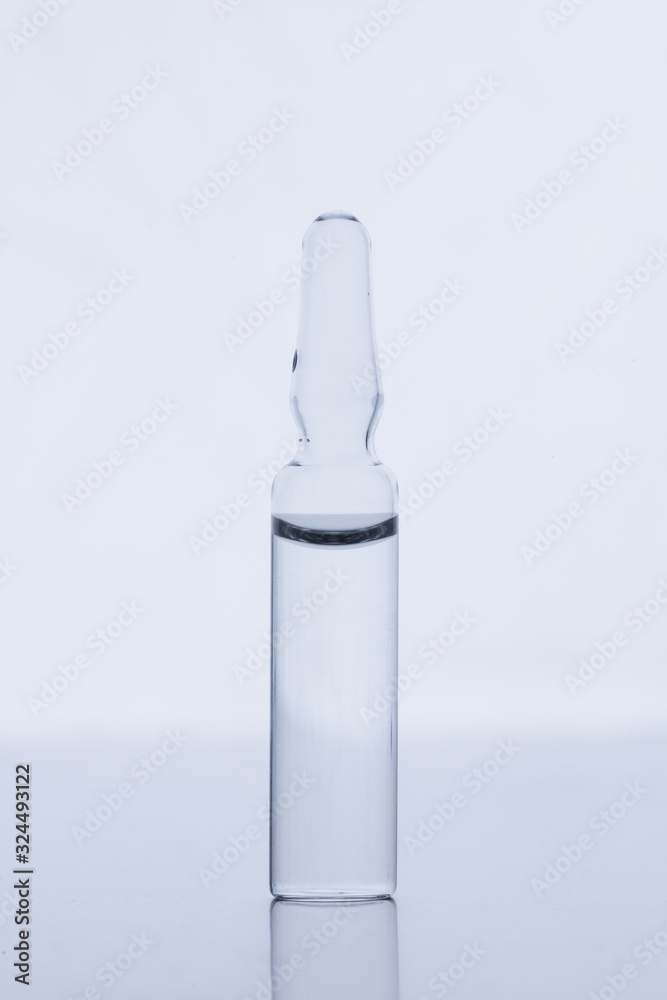glass ampoule for injection on a white background. glass ampoule for injection on a white background.