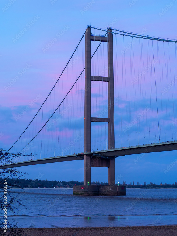 Obraz premium One of the main towers of the Humber Bridge just before sunset, North Lincolnshire, England