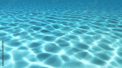 Beautiful underwater caustics. Sunlight shimmering and falling to the ocean floor. Abstract 4k stock footage.
