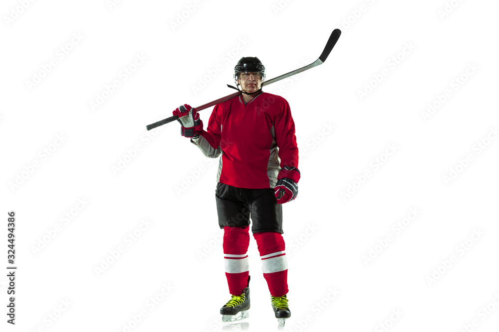 Activity. Male hockey player with the stick on ice court and white background. Sportsman wearing equipment and helmet practicing. Concept of sport, healthy lifestyle, motion, movement, action. Activity. Male hockey player with the stick on ice court and white background. Sportsman wearing equipment and helmet practicing. Concept of sport, healthy lifestyle, motion, movement, action.