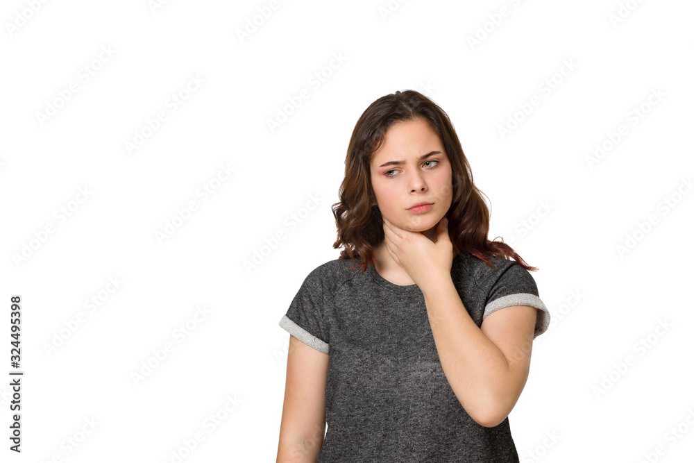Young worried teen with a sore throat on a white background Young worried teen with a sore throat on a white background