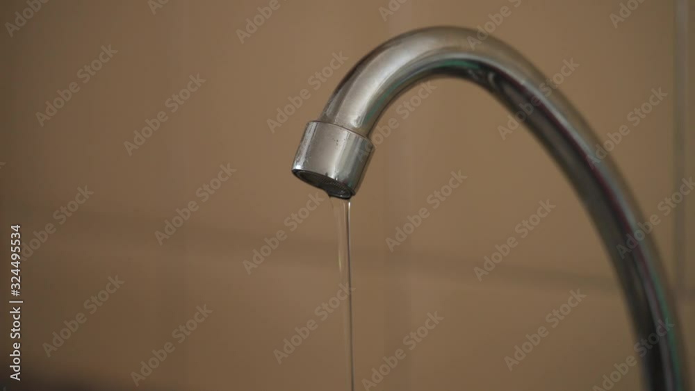 Kitchen faucet streaming clean water at low pressure Kitchen faucet streaming clean water at low pressure