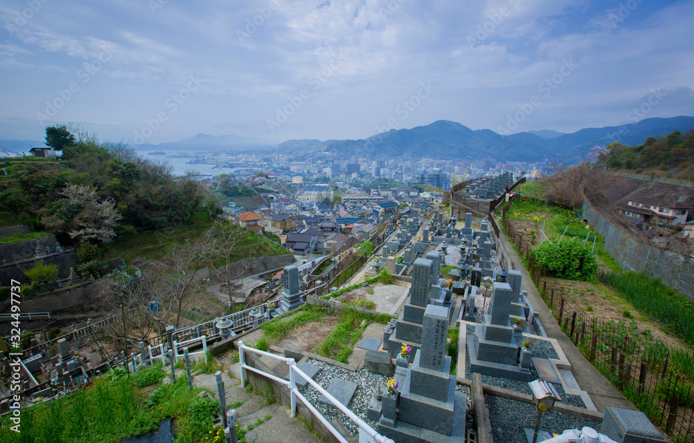 View from the hill to the old Japanese cemetery. Against the backdrop of mountains and sea. Kure Island