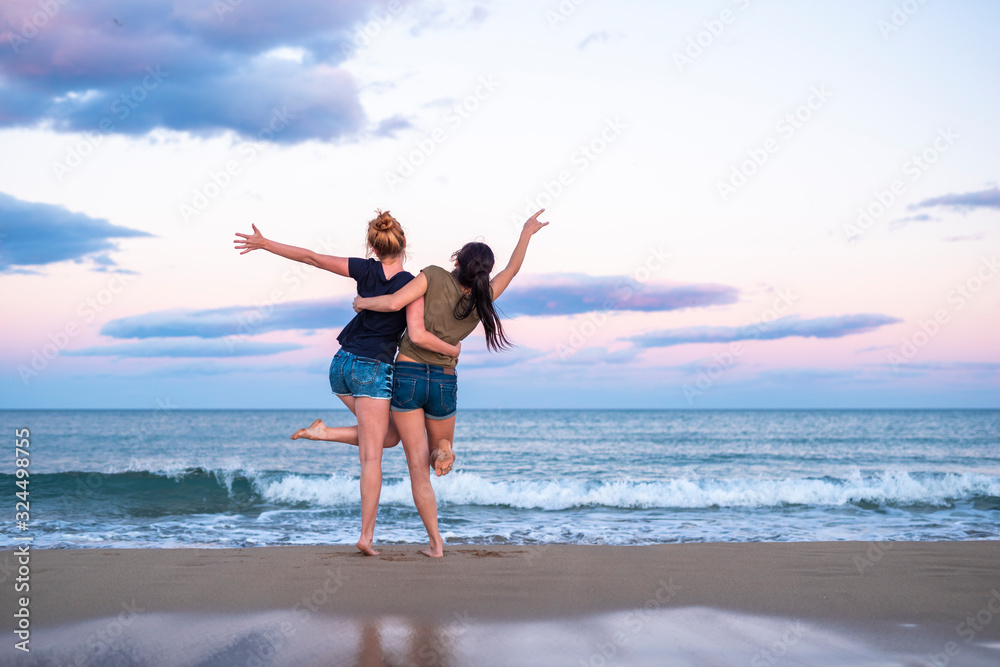 Two pretty young girls pretty best friend women having fun on their summer vacation on Mediterranean sea, mini denim shorts, amazing blonde and brunette hairs, traveling experience, happy emotions Two pretty young girls pretty best friend women having fun on their summer vacation on Mediterranean sea, mini denim shorts, amazing blonde and brunette hairs, traveling experience, happy emotions
