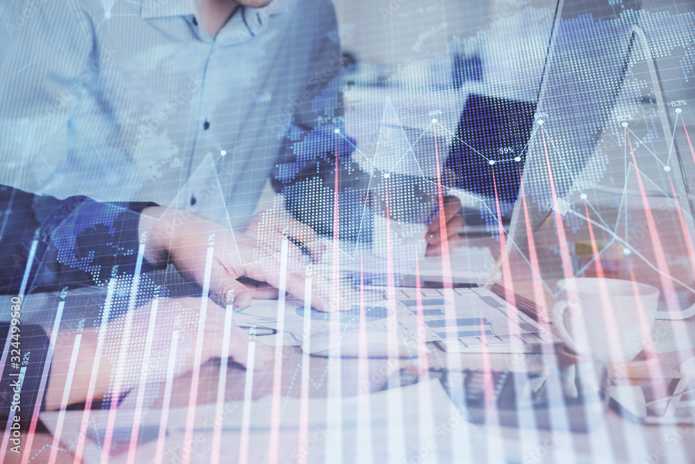 Multi exposure of chart with man typing on computer in office on background. Concept of hard work. Multi exposure of chart with man typing on computer in office on background. Concept of hard work.
