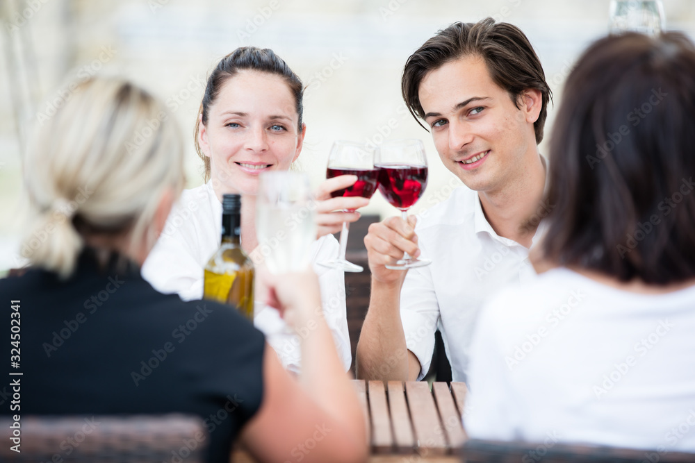 Group of friends drinking wine in a winery Group of friends drinking wine in a winery