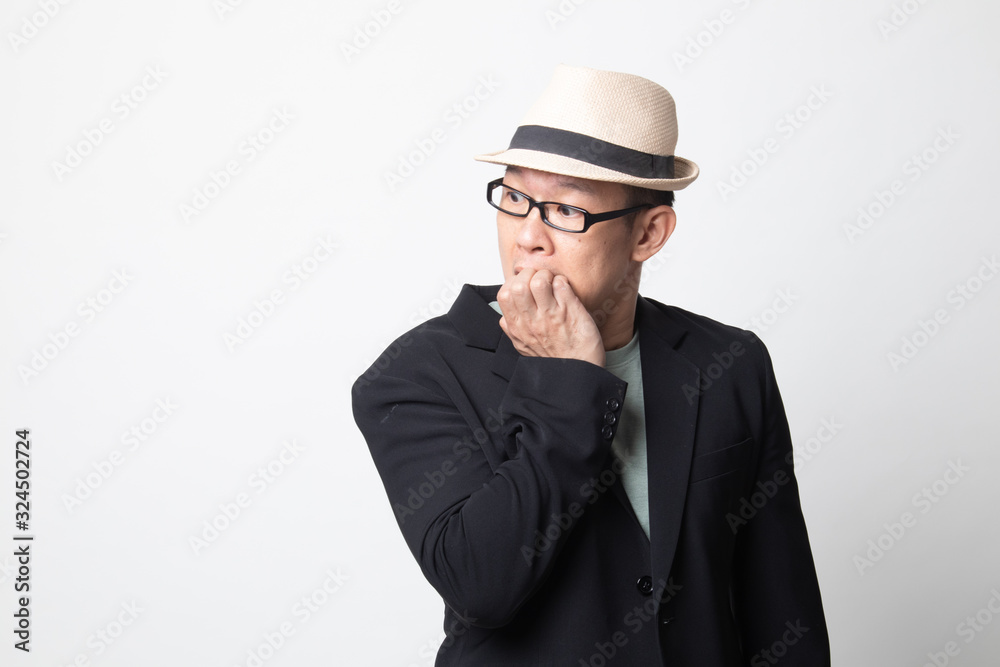 Unsure hesitant nervous adult asian man biting his fingernails. Unsure hesitant nervous adult asian man biting his fingernails.