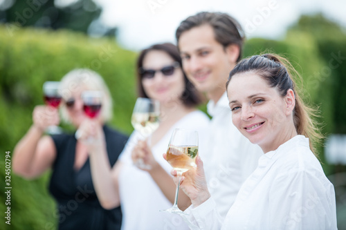 Group of people tasting wine in a winery