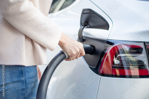 woman Charges electric car