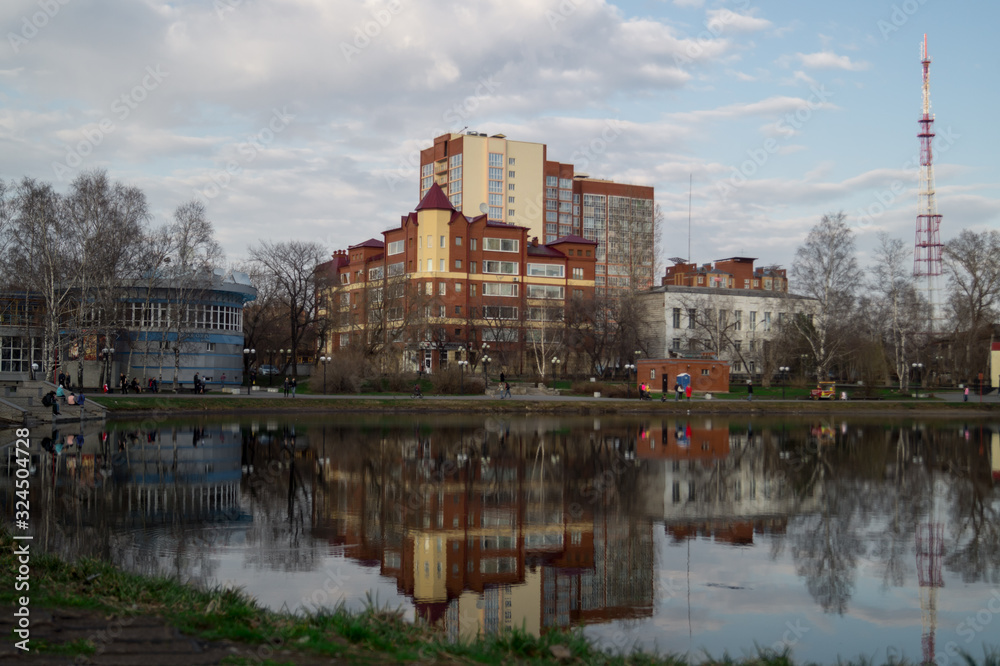 Siberian city of Tomsk in the reflection of the lake