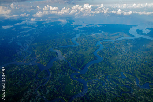 River in tropic Costa Rica, Corcovado NP. Lakes and rivers, view from airplane. Green grass in Central America. Trees with water in rainy season. Photo from air. © ondrejprosicky