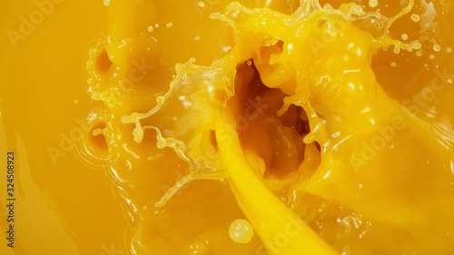 Detail of pouring orange juice