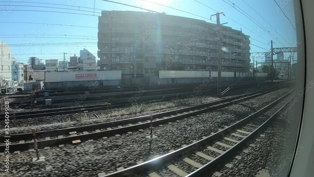 trip travel by train in japan, looking at view of town through the window scene trip travel by train in japan, looking at view of town through the window scene