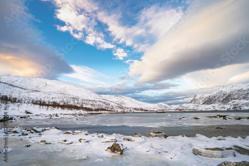 Billede på lærred winterlandscape with dramatic sky on Kvaloeya Island near Tromsoe in northern No