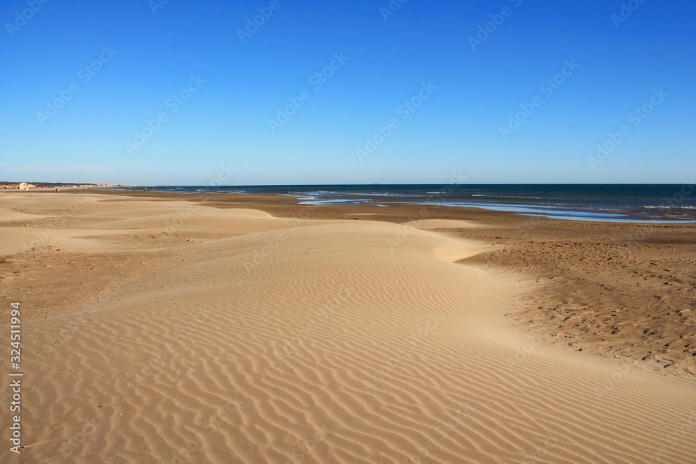 The Amazing sandy beach in Gruissan in the Aude department, France The Amazing sandy beach in Gruissan in the Aude department, France