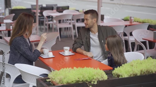 Family walk, breakfast in a cafe, parent-child communication, relaxation in a coffee shop