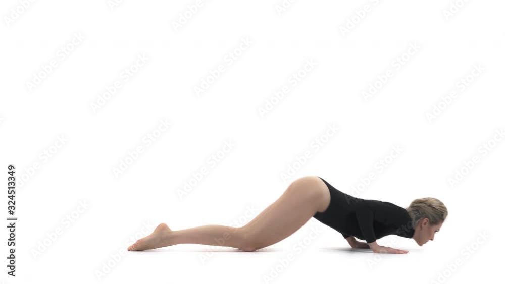 Professional gymnast standing in cat yoga pose and planque. Isolated, on white background Professional gymnast standing in cat yoga pose and planque. Isolated, on white background