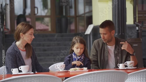 Family walk, breakfast in a cafe, parent-child communication, relaxation in a coffee shop