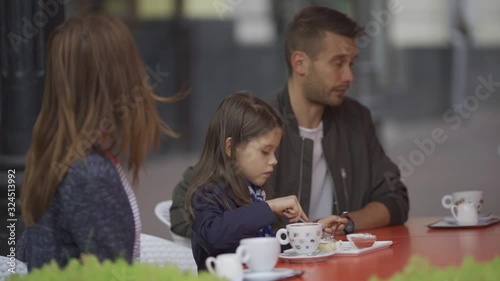 Family walk, breakfast in a cafe, parent-child communication, relaxation in a coffee shop