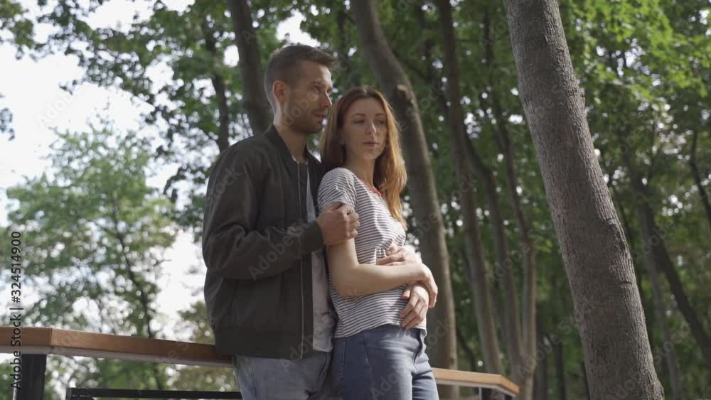 Beautiful couple on an alley in the park, date, walk Beautiful couple on an alley in the park, date, walk
