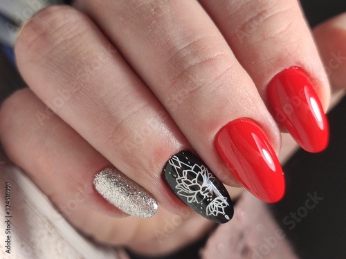 Beautiful woman's nails with beautiful christmas manicure