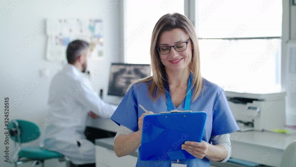 A portrait of dental assistant and dentist in modern dental surgery.