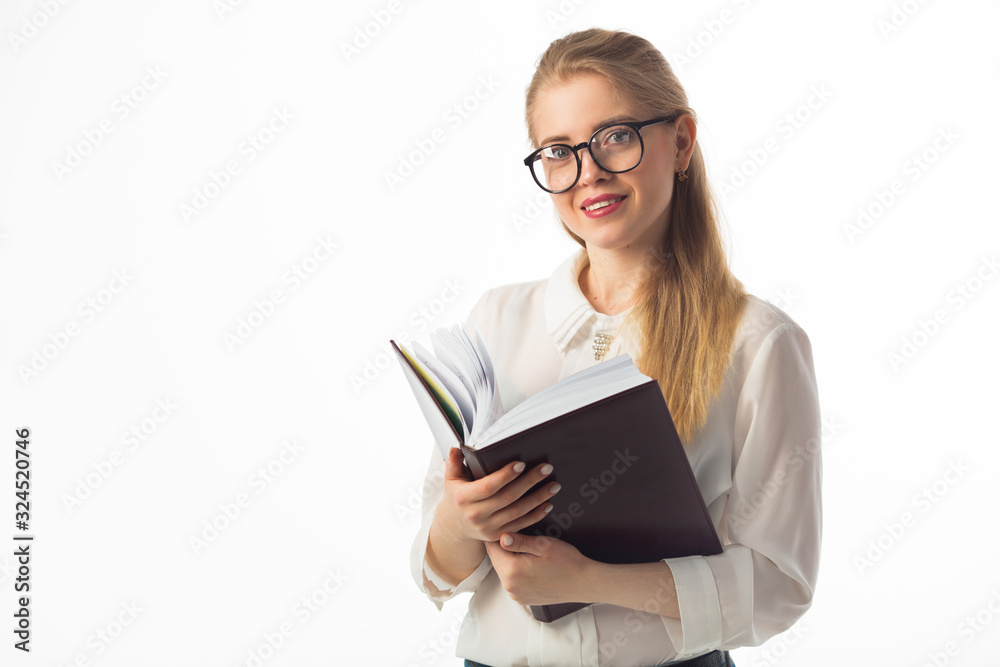 beautiful young woman in a shirt on a white background with a notebook notepad beautiful young woman in a shirt on a white background with a notebook notepad