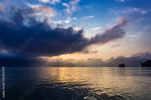 Sunset at Khao Sok National Park, Cheow Lan Lake, Thailand photo