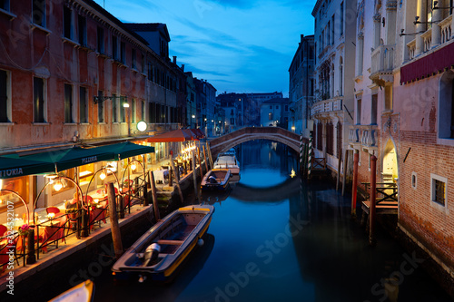 Venetian street and canal at night