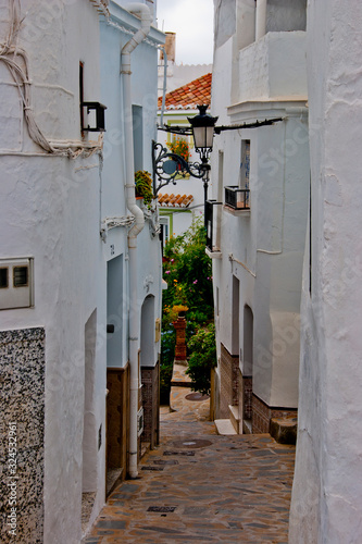 Tiled narrow streets in the Spanish white village of Competa on the Costa Del Sol, Andalusia, Spain