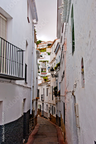 Tiled narrow streets in the Spanish white village of Competa on the Costa Del Sol, Andalusia, Spain © Andy Evans Photos