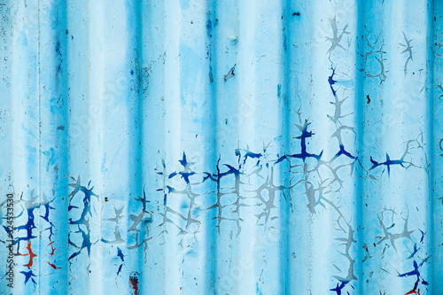 Metal curly sheets are painted in sky-blue color, old cracked paint. Abstract grunge texture. © Елена Труфанова
