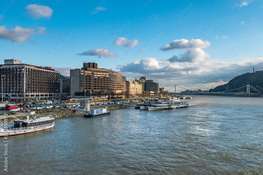 Obraz premium aerial view of Budapest on Danube river under dramatic sky