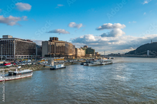 aerial view of Budapest on Danube river under dramatic sky