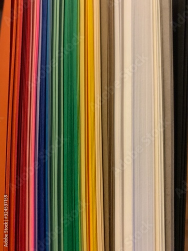 Stack of multi color rainbow paper craft book heavy weight photo picture (ID: 324537159)